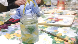 Glass jars decorated as t-lights